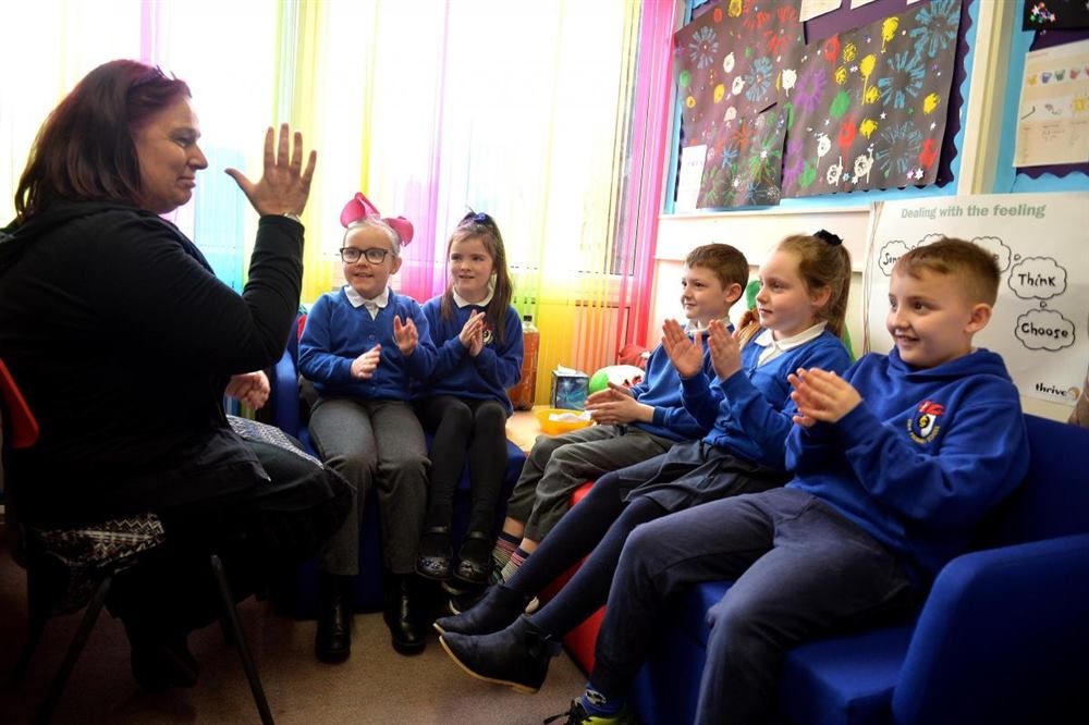 A small group session in a bright classroom