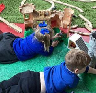 Pupils building a castle during play