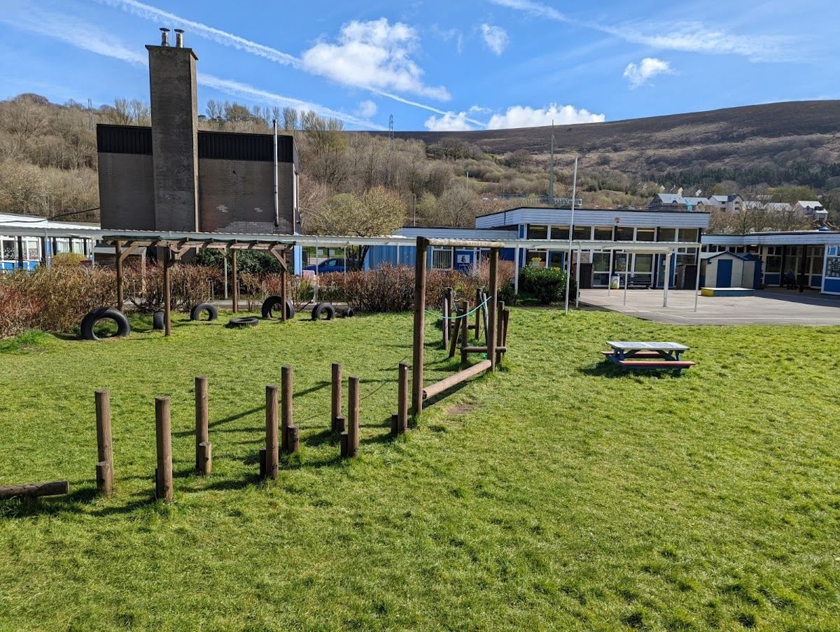 The school grounds with the valley hillside behind
